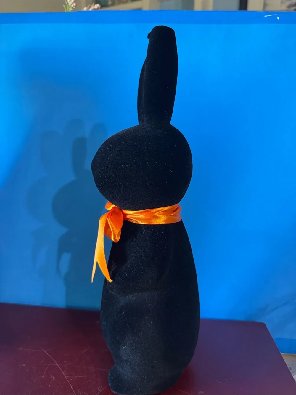 Black flocked (fuzzy) bunny figurine w/orange bow contemporary Easter- NEW